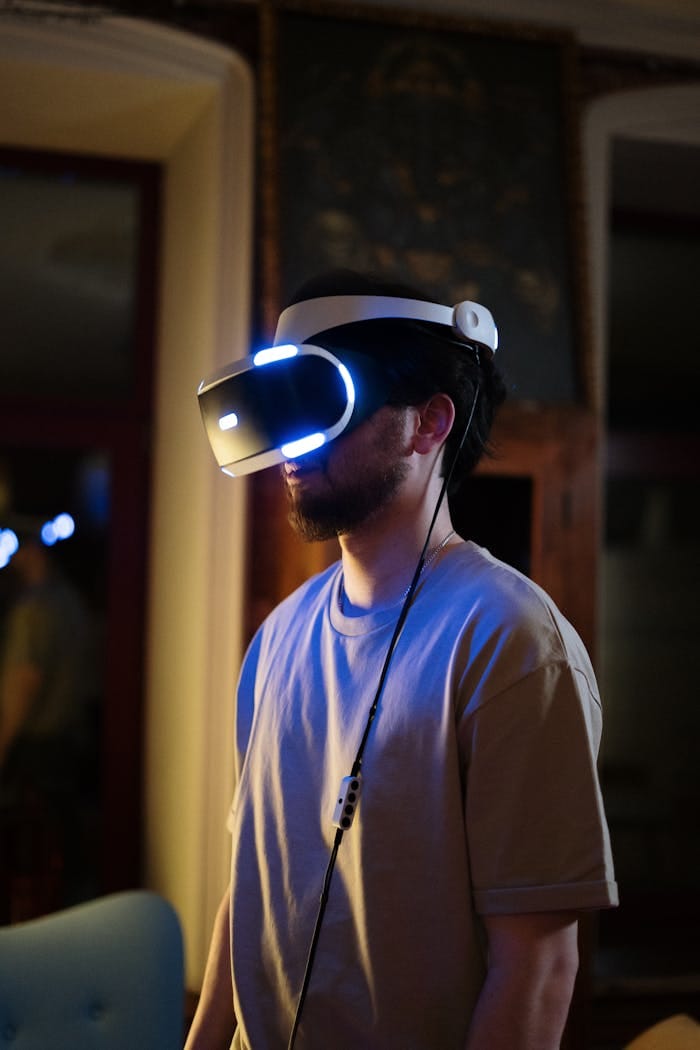 A man enjoys virtual reality gaming at home wearing a VR headset in a cozy indoor setting.